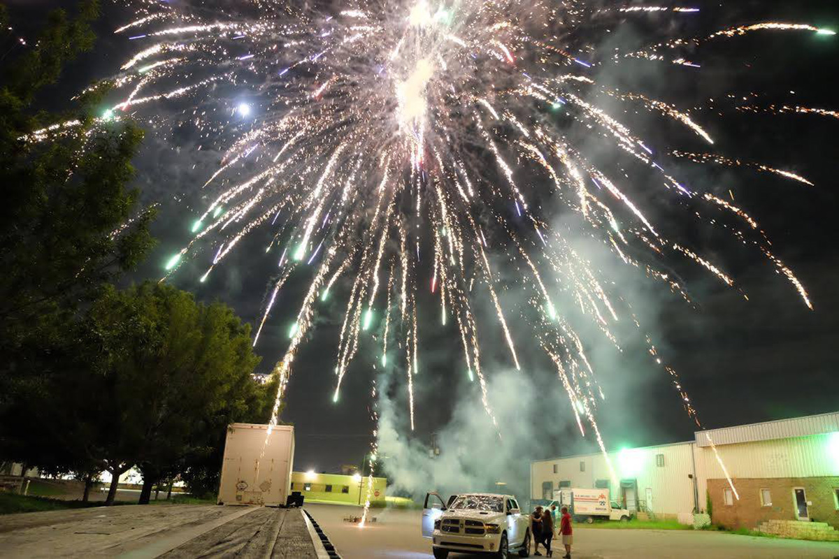 A large version of fireworks bursting in the night
